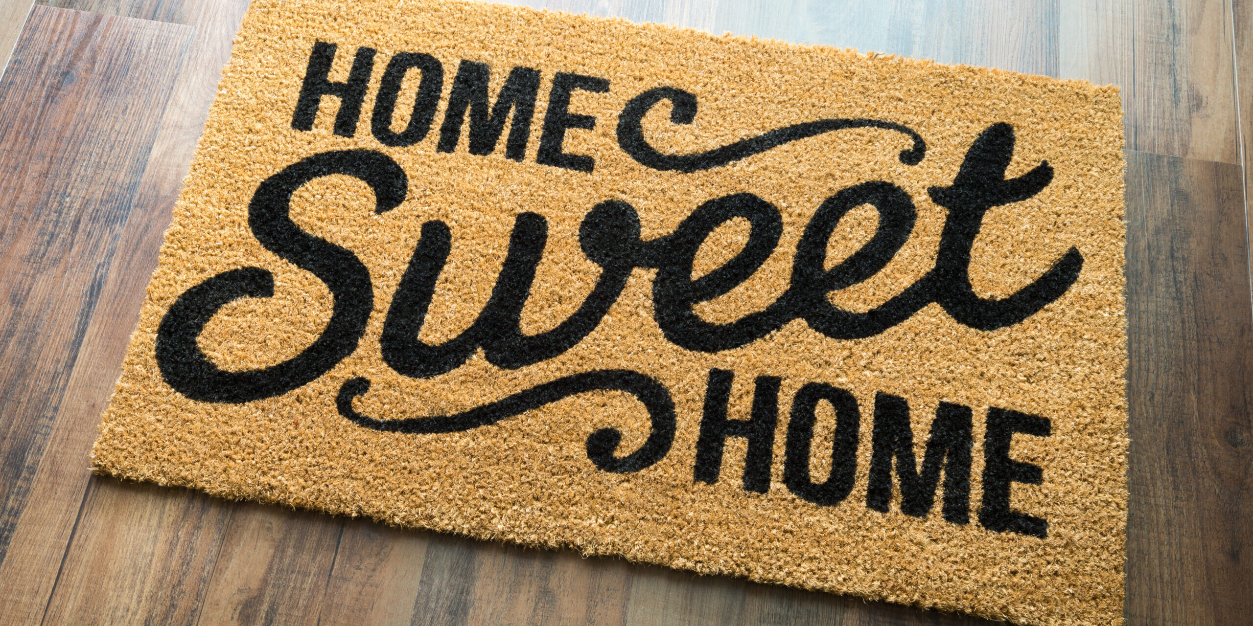 Home Sweet Home Welcome Mat On Wood Floor. Zillow Blog