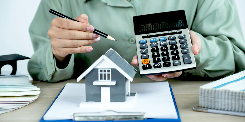 Property agents hand holdimg pencil and offer price fabric for h New Mortgage Fee Structure 2024 Update